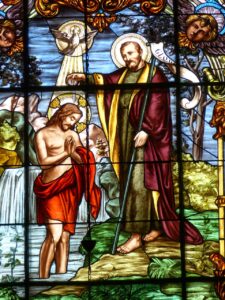 Jesus is baptized by John the Baptist